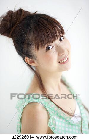 Picture - Portrait of young woman, white background. Fotosearch