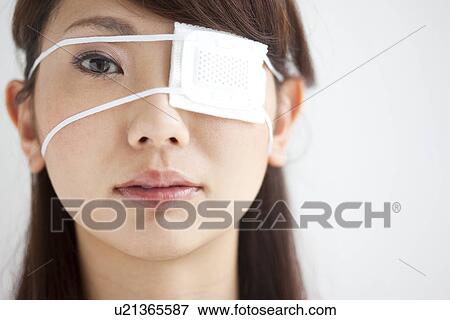 Portrait Of Young Woman With Eye Patch Close Up White Background Stock Photo U Fotosearch