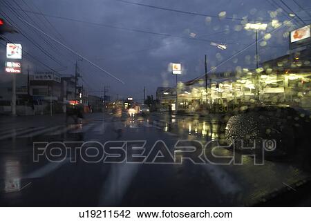 Stock Image - Rain Falling on Windscreen. Fotosearch