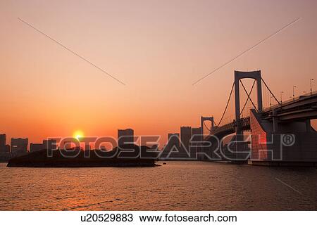 Stock Image - Rainbow bridge at dusk. Fotosearch