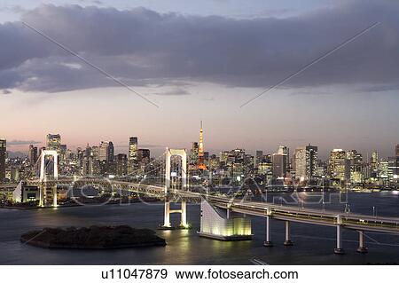 Stock Photo - Rainbow bridge at dusk. Fotosearch