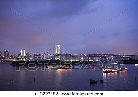 Stock Image - Rainbow bridge at night. Fotosearch