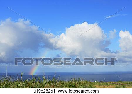 Stock Image - Rainbow in Sea, Hawaii, USA. Fotosearch