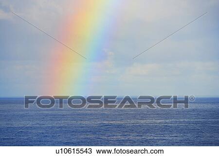 Stock Image - Rainbow Over Sea, Hawaii, USA. Fotosearch