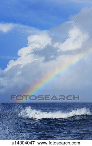 Stock Photo - Rainbow Over the Sea, Hawaii, USA. Fotosearch