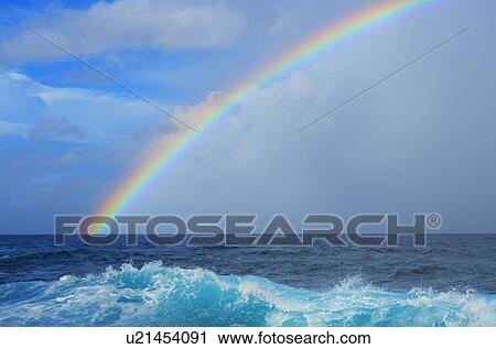 Stock Image - Rainbow Over the Sea. Fotosearch