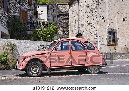 Red Antique Car on Street, La region d'Auvergne, France View Large Photo Image Stock Image - Red Antique Car on Street, La region d'Auvergne, France. Fotosearch