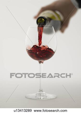 Red wine pouring into grass, close up, white background View Large Photo Image Stock Photo - Red wine pouring into grass, close up, white background. Fotosearch