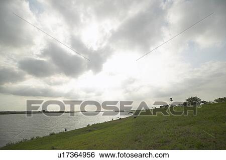 Stock Photograph - River and sky, Ibaraki Prefecture, Honshu, Japan. Fotosearch
