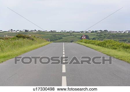 Stock Photo - Road in the Center, Houses in the Background, Finistere, Bretagne, France. Fotosearch
