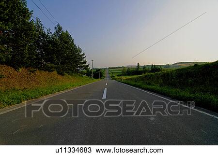 Stock Image - Road in the evening. Fotosearch