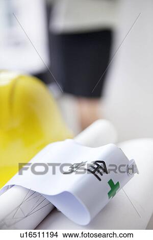 Picture - Safety arm band and blueprint. Fotosearch