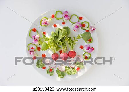 Stock Photograph - Salad with flowers, white background. Fotosearch
