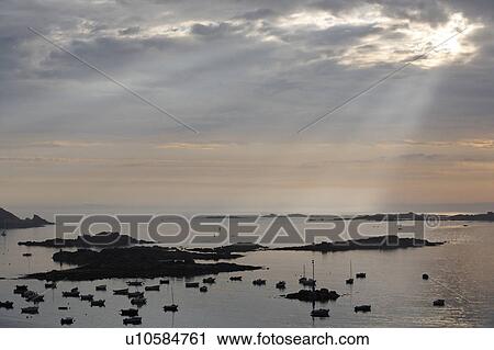 Stock Image - Silhouette of Islands in Sea, Bretagne, France. Fotosearch