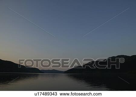 Silhouette of Mountains and Calm Lake View Large Photo Image Stock Image - Silhouette of Mountains and Calm Lake. Fotosearch