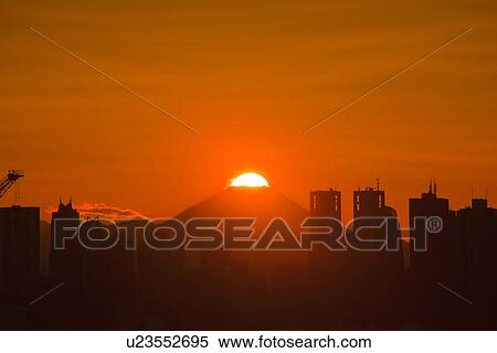 Stock Photography - Skyline of Shinjuku and Mt. Fuji at dusk. Fotosearch