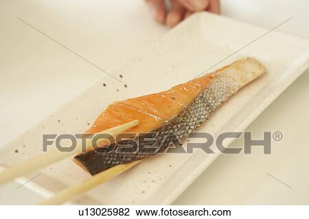 Slice of grilled salmon on plate, close up, white background View Large Photo Image Stock Image - Slice of grilled salmon on plate, close up, white background. Fotosearch