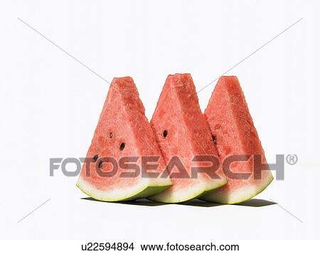 Slices of watermelon, white background View Large Photo Image Picture - Slices of watermelon, white background. Fotosearch