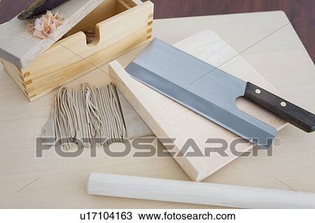 Stock Image - Soba noodles and died bonito on grater. Fotosearch