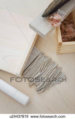 Stock Photo - Soba noodles and died bonito on grater. Fotosearch