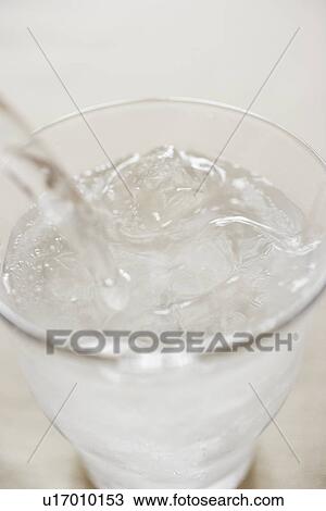 Soda pouring into glass, close up View Large Photo Image Stock Image - Soda pouring into glass, close up. Fotosearch