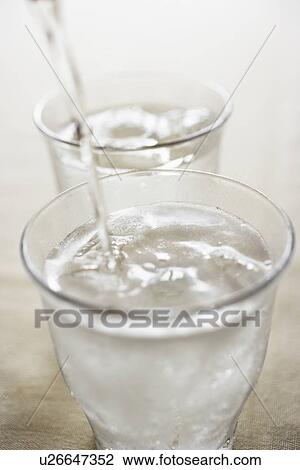 Soda pouring into glass, close up View Large Photo Image Stock Image - Soda pouring into glass, close up. Fotosearch