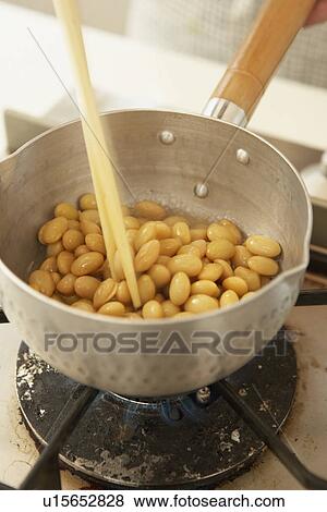 Soybeans being fried in pan, close up View Large Photo Image Stock Photo - Soybeans being fried in pan, close up. Fotosearch