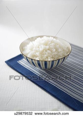 Stock Image - Steamed rice in bowl. Fotosearch