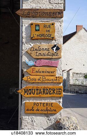 Stock Image - Store signs in France. Fotosearch