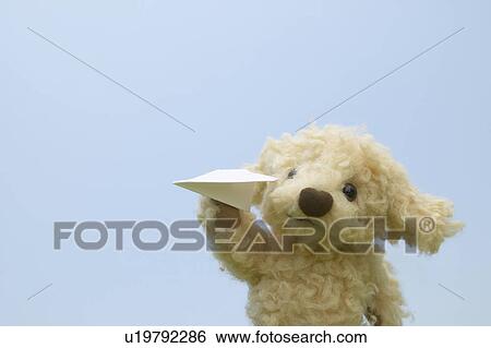 Stuffed Toy Holding Paper Airplane View Large Photo Image Stock Photograph - Stuffed Toy Holding Paper Airplane. Fotosearch
