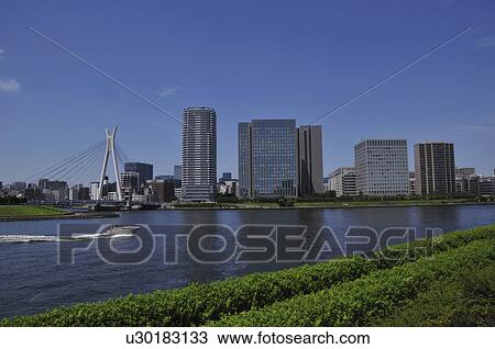 Stock Image - Sumida river and Tokyo skyline. Fotosearch