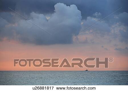 Stock Photo - Sunset Sky Over Sea Horizon. Fotosearch