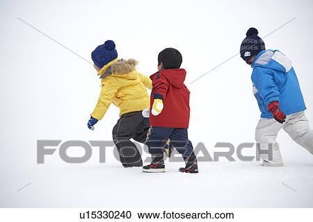 Three boys playing in snow View Large Photo Image Stock Image - Three boys playing in snow. Fotosearch