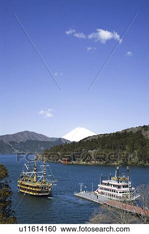 Stock Image - Tourboat and Mt. Fuji. Fotosearch