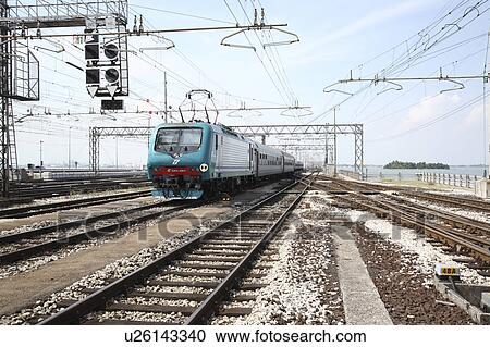 Stock Image - Train on Ponte della Liberta (the Freedom Bridge), Venice Italy. Fotosearch