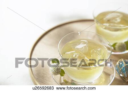 Stock Image - Two cups of iced green tea. Fotosearch
