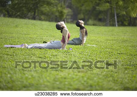 Stock Photography - Two Young Women Stretching. Fotosearch