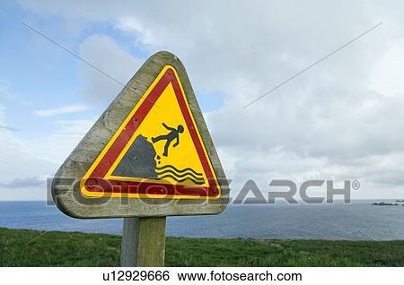 Stock Photograph - Warning Sign Near Cliff, Bretagne, France. Fotosearch