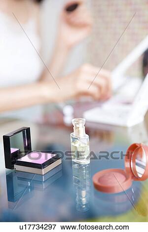 Woman applying makeup View Large Photo Image Stock Photo - Woman applying makeup. Fotosearch