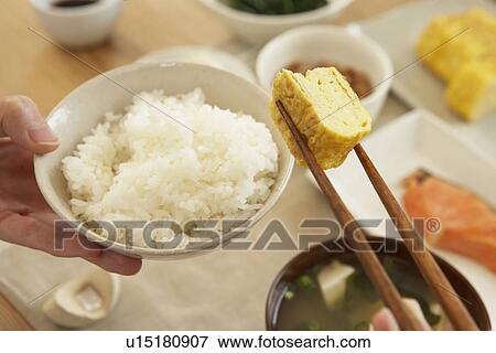 Stock Photo - Woman having breakfast, close up. Fotosearch