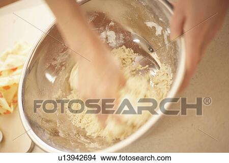 Woman making bagels, making dough, close up, blurred motion View Large Photo Image Picture - Woman making bagels, making dough, close up, blurred motion. Fotosearch