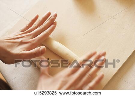 Woman making bagels, rolling dough, close up, blurred motion View Large Photo Image Stock Photography - Woman making bagels, rolling dough, close up, blurred motion. Fotosearch