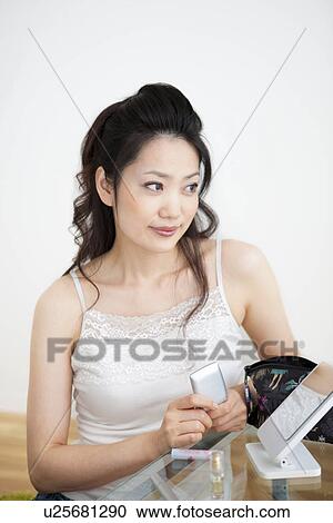 Stock Image - Woman with make-up on. Fotosearch