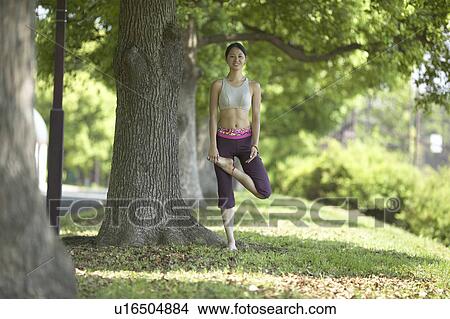 Young Woman Doing A Stretching Exercise Under Tree View Large Photo Image Picture - Young Woman Doing A Stretching Exercise Under Tree. Fotosearch