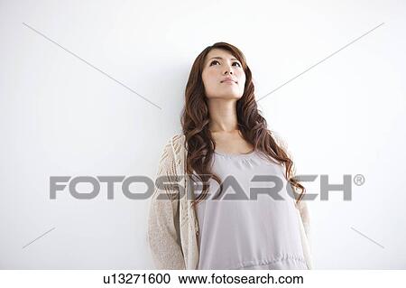 Stock Image - Young woman on white background. Fotosearch
