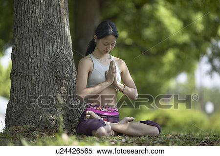 Young Woman Practicing Meditation Under Tree View Large Photo Image Stock Photography - Young Woman Practicing Meditation Under Tree. Fotosearch