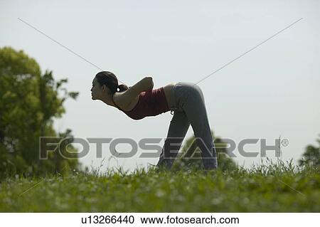 Stock Image - Young Woman Stretching. Fotosearch