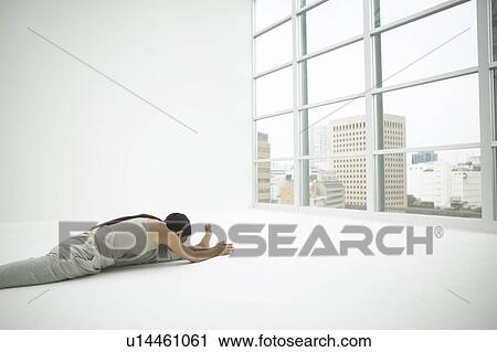 Stock Image - Young Woman Stretching. Fotosearch