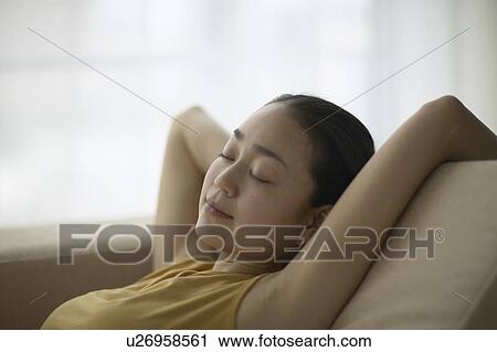 Young Woman Taking Nap on Sofa View Large Photo Image Stock Image - Young Woman Taking Nap on Sofa. Fotosearch