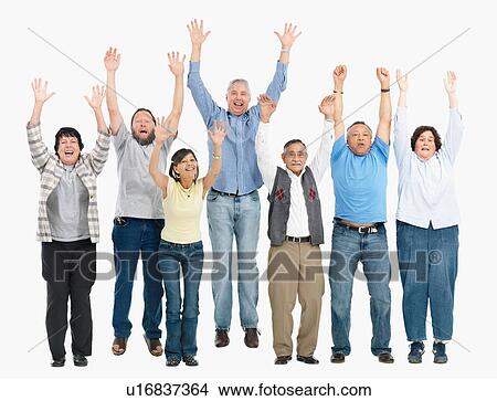 Picture - A group of people jumping with their arms raised. Fotosearch